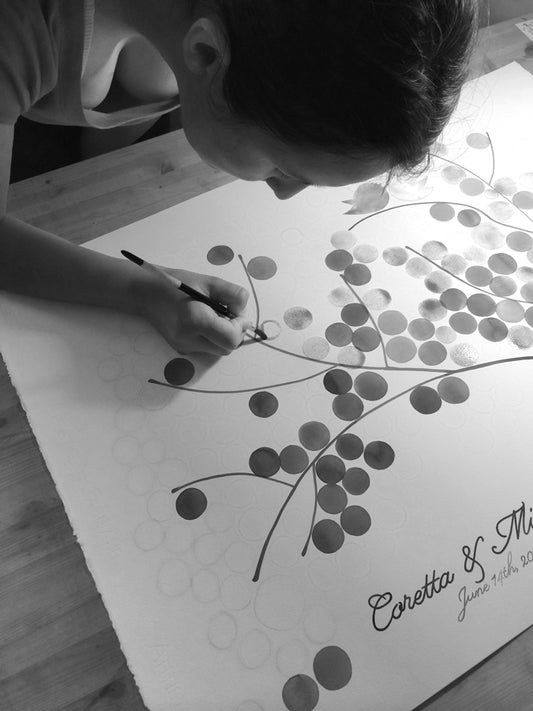Elena painting a wedding guest book